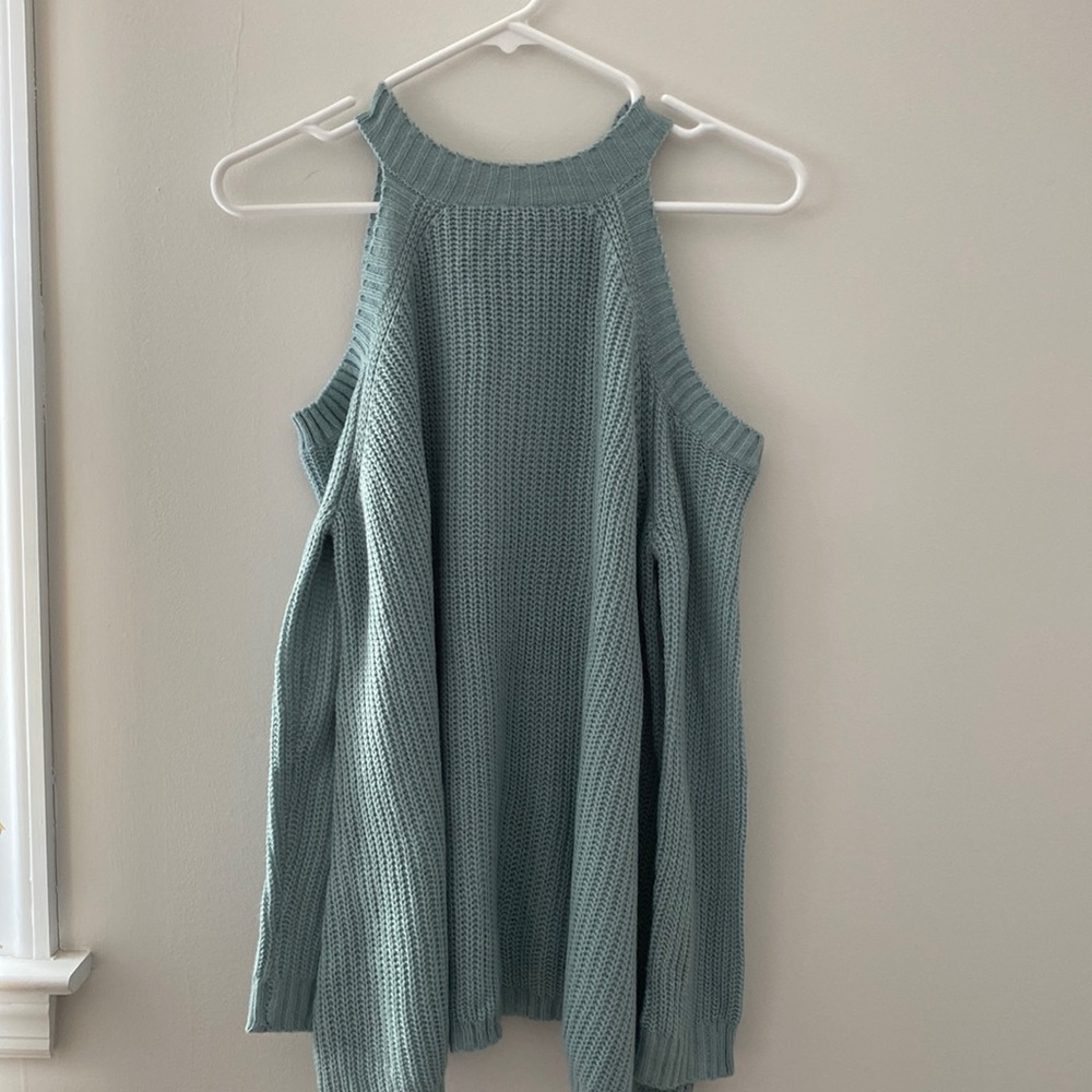 Sweater with shoulder cut outs